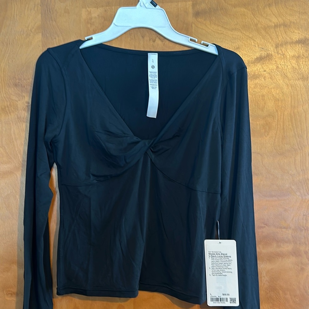 modal-blend long sleeve has a deep v-neckline and a twist-front detail
